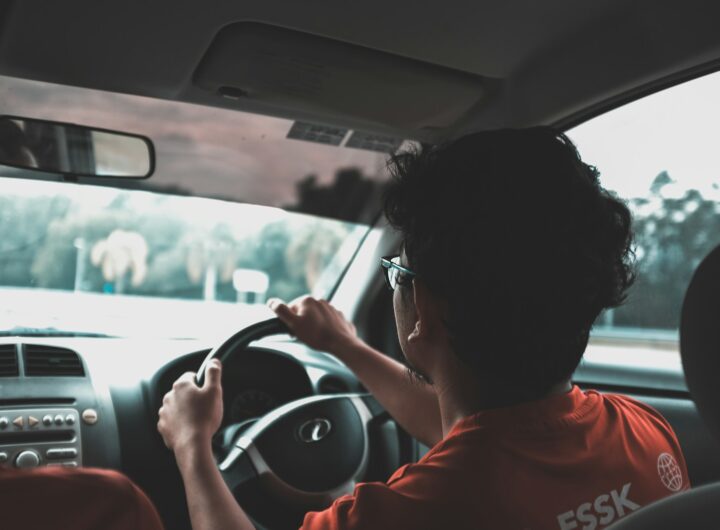 man driving car